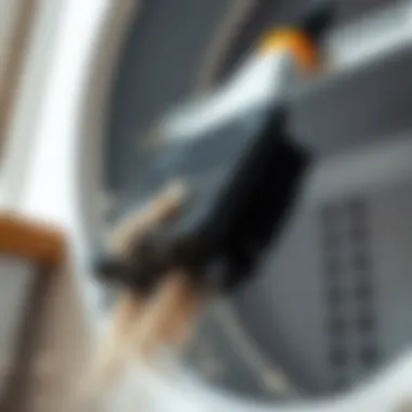 A dryer vent cleaning brush in action