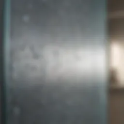 Close-up view of hard water spots on shower glass
