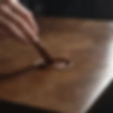 Demonstrating Stain Removal Technique Demonstration of a stain removal technique on a surface