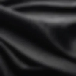 A close-up view of a fabric with a prominent black ink stain.