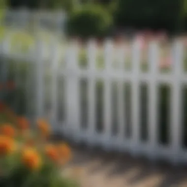 Charming little white garden fence surrounding a vibrant flower bed