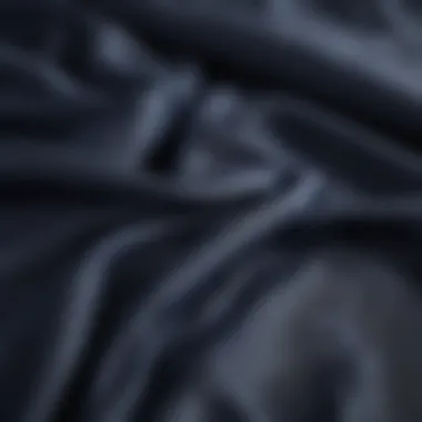 Luxurious Fabric Textures of Navy Bedding Close-up of luxurious fabric textures used in navy blue coastal bedding.