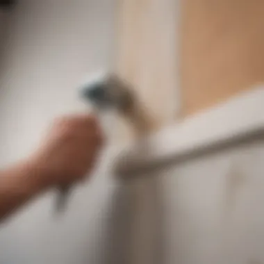 Close-up of a painter using an edging tool on a wall