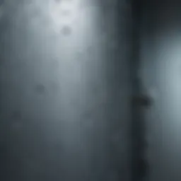 Close-up view of water droplets on shower glass demonstrating water repellent properties